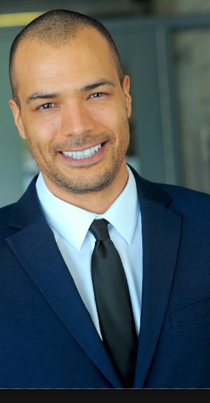 Ethan Stone in a navy suit